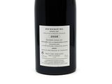 a bottle of wine that is sitting on a table