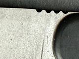 a knife that is sitting on a table