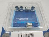 a package of screws in a plastic container on a table