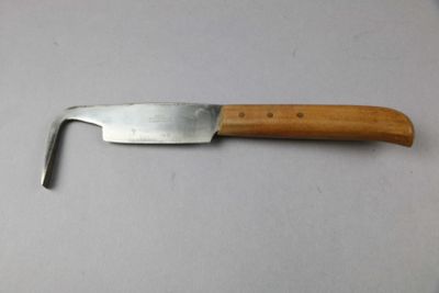 a knife with a wooden handle on a table