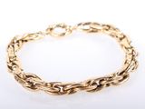 a gold chain bracelet on a white background