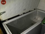 a white chest freezer sitting inside of a kitchen