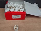 a box of white electrical plugs on a table