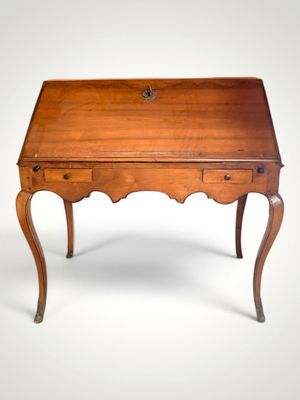 an old wooden desk with a drawer on top of it
