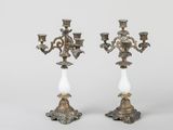 pair of antique brass candelabs with white glass