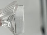 a person holding a plastic cup in their hand