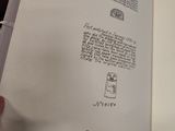 a person holding a book open to a page