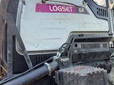 a large machine that is sitting in the dirt
