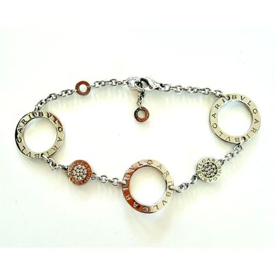 silver and copper bracelet with charms and words on a chain