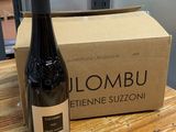 a bottle of wine sitting on a table next to a box
