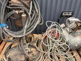 a pile of wires and a hose on a pallet