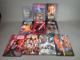 a lot of star wars books on the table