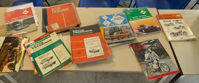 a table with many books on it that are sitting on the table