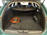 the trunk of a car with a hose in the back of it