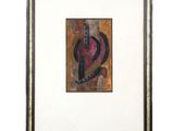 une peinture abstraite représentant un objet rouge et noir dans un cadre doré