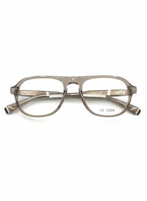 a pair of glasses sitting on top of a white surface