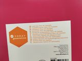 the back of a pink plastic container with a label on it