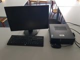 a desktop computer sitting on a desk with a keyboard and mouse