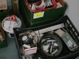 two boxes of electronics sitting on the floor next to each other