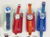 a lot of watches that are sitting on a table