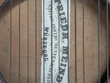 an old wooden guitar with a label on it