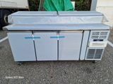 an image of a refrigerator sitting in a parking lot with its doors open