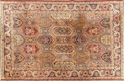 an antique persian rug with a medallion design