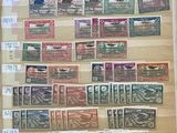 a picture of a collection of stamps on display in a glass case