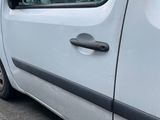 a white van parked on the side of the road
