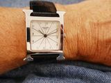 a person that is wearing a watch on his wrist