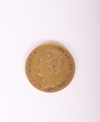 l'image d'une pièce d'or sur laquelle figure l'image d'un homme