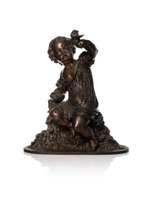 bronze statue of a boy with a bird on his shoulder