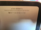 a close up of a laptop with a bar code on it