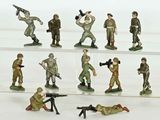 many figurines of soldiers with guns on display