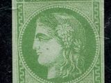 a green stamp with a woman ' s face on it