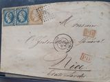 an old envelope with stamps on it sitting on a table