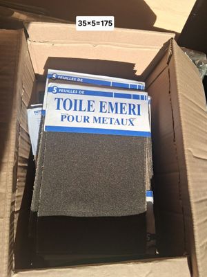 a cardboard box with a box of toilet liners in it