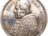 an image of a silver coin with a portrait of a man on it