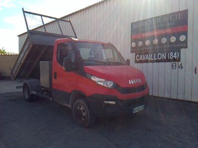 a red truck that is parked in front of a building