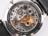 a close up of a watch on a white surface