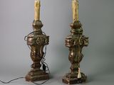 pair of antique brass table lamps with candles on top of them