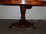 a round table with a wooden top and a wooden base