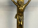 an antique bronze crucifix with jesus on the cross