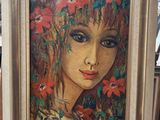 painting of a woman with flowers in her hair in a gold frame