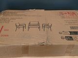 cardboard box sitting on top of a wooden table next to a blue wall