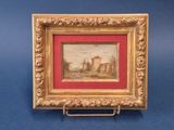 an old picture frame with a painting of a castle in the background
