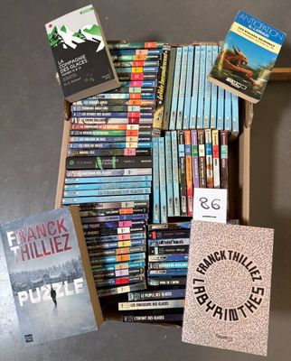 a lot of books in a box on the table