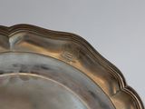 a silver plate that is sitting on a table