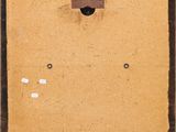 an old picture of a piece of cardboard with a hole in it