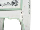 a white and green cabinet with flowers painted on it